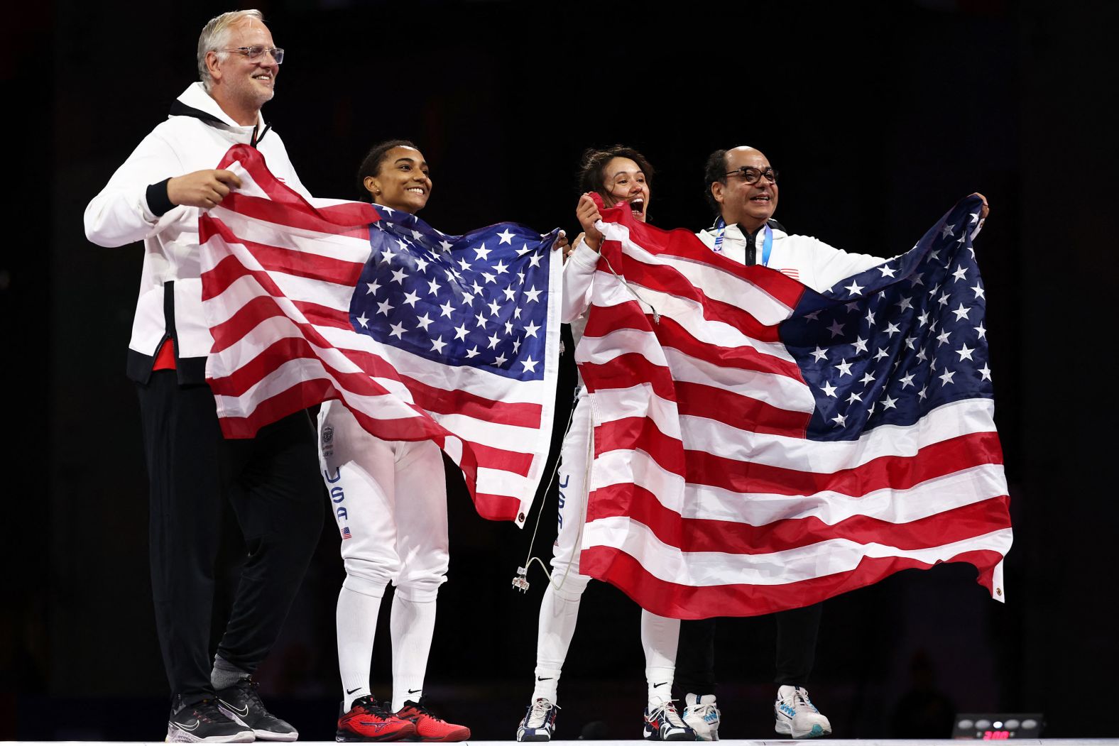 US fencers Lauren Scruggs, center left, and Lee Kiefer celebrate after facing off in the foil final on July 28. <a href="https://www.cnn.com/sport/live-news/paris-olympics-news-2024-07-28#h_a5ef3047654247f764f7f57ca714fe53">Kiefer overwhelmed Scruggs 15-6</a> to win the event for the second straight Olympics.