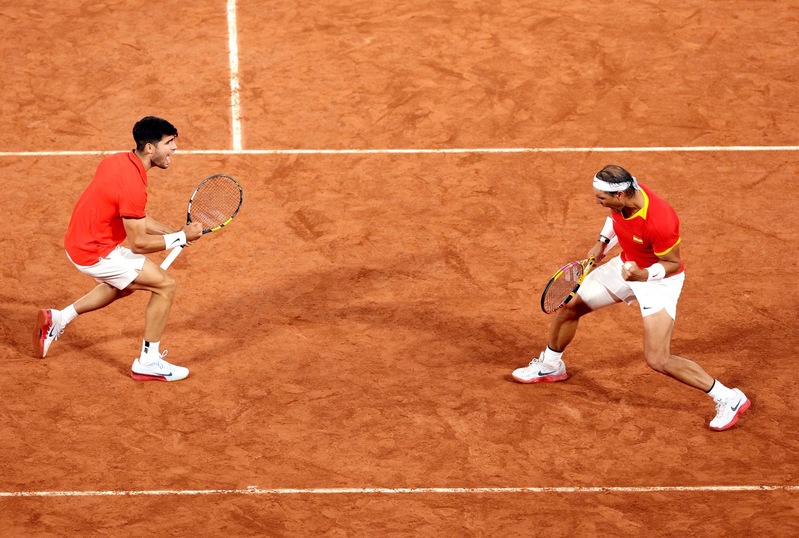 Spanish tennis players Carlos Alcaraz and Rafael Nadal celebrate during a doubles match on July 27. <a href="https://www.cnn.com/2024/07/27/sport/rafael-nadal-carlos-alcaraz-paris-olympics-tennis-spt-intl/index.html">The dream pairing</a> beat Argentina’s Máximo González and Andrés Molteni 7-6, 6-4.