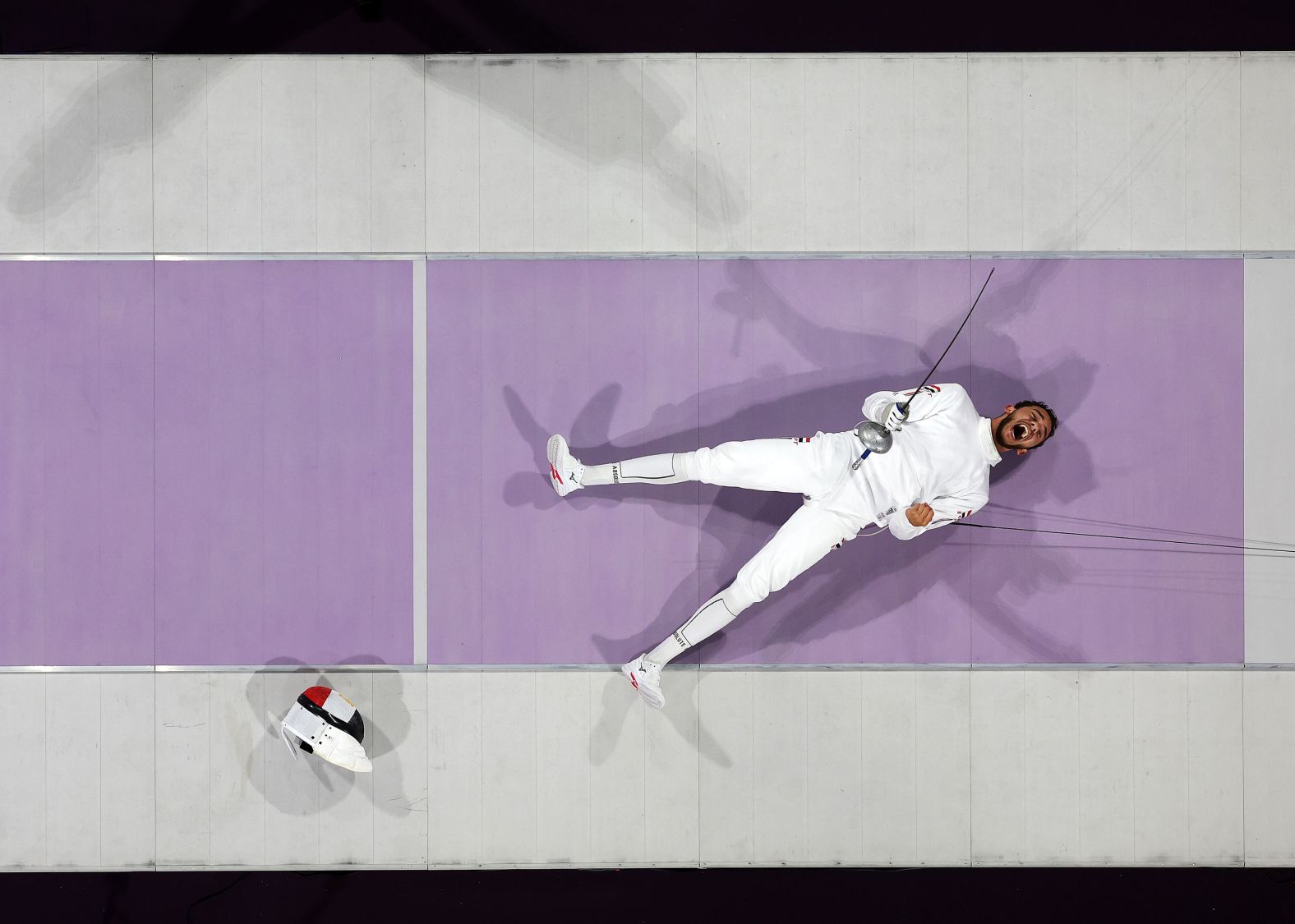 Egyptian fencer Mohamed El-Sayed celebrates after winning the bronze-medal épée bout on July 28.