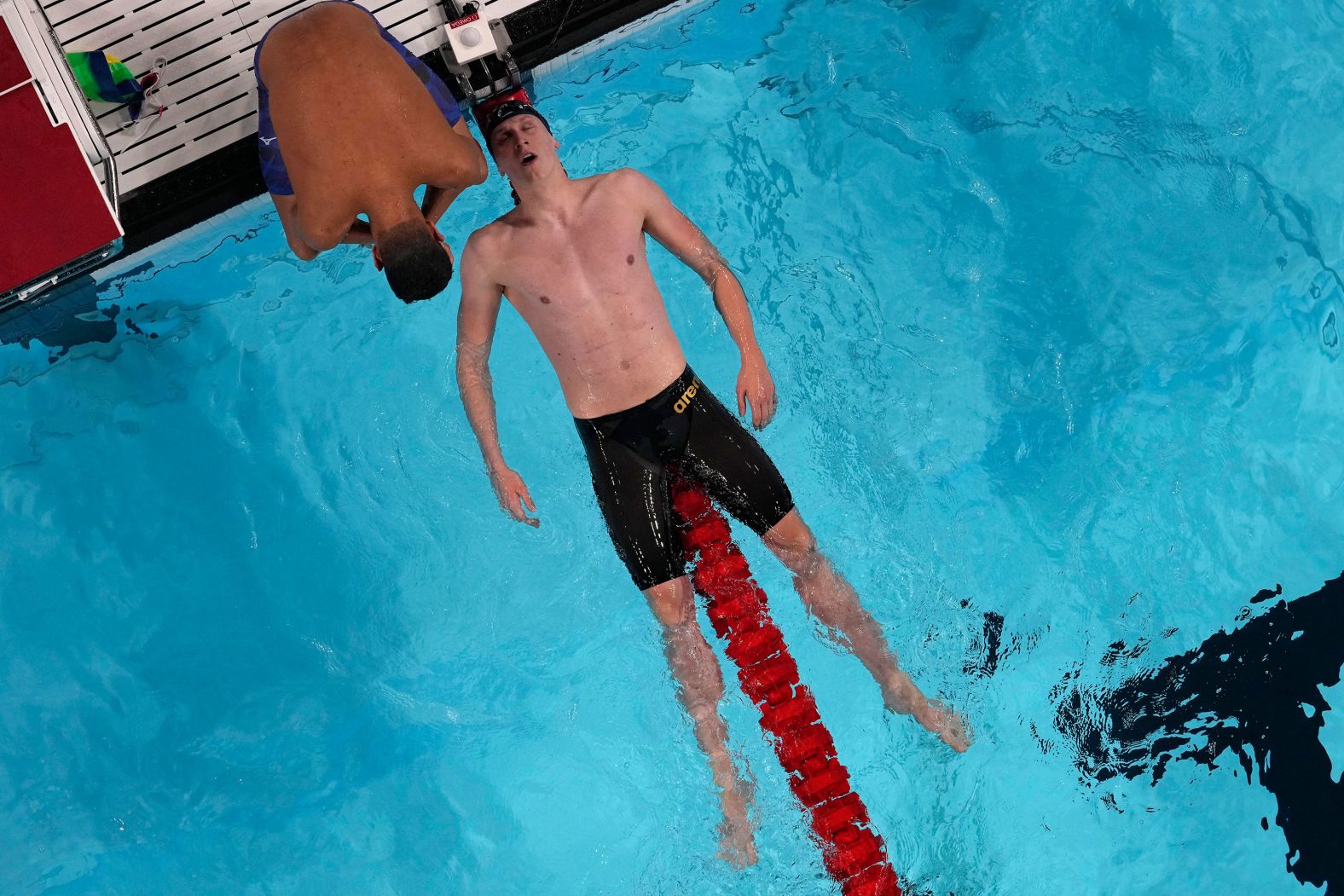 Germany's Lukas Maertens falls back on a lane rope after <a href="https://www.cnn.com/sport/live-news/paris-olympics-news-2024-07-27#h_1beab8746685bb7d0ce495bbcc6c3618">winning the 400-meter freestyle</a> on July 27.