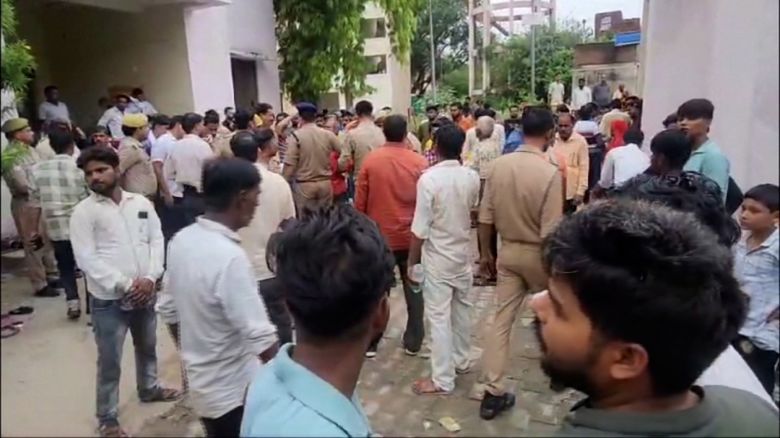 Crowds gather outside the emergency department of an Etah hospital. 