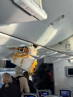 Damage on the inside of the plane that was forced to land in Brazil after turbulence.