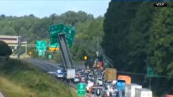 <p>A truck’s raised trailer struck an overhead sign on a Virginia highway, leaving traffic snarled for hours.</p>