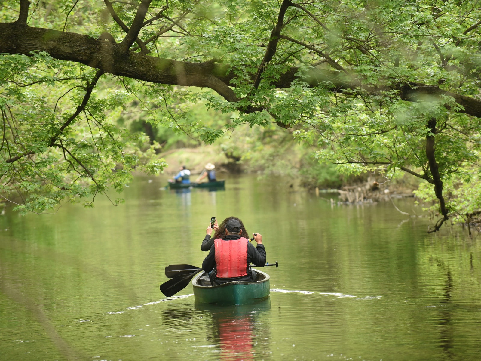 Image may contain Human Person Vehicle Transportation Rowboat Boat Canoe and Water