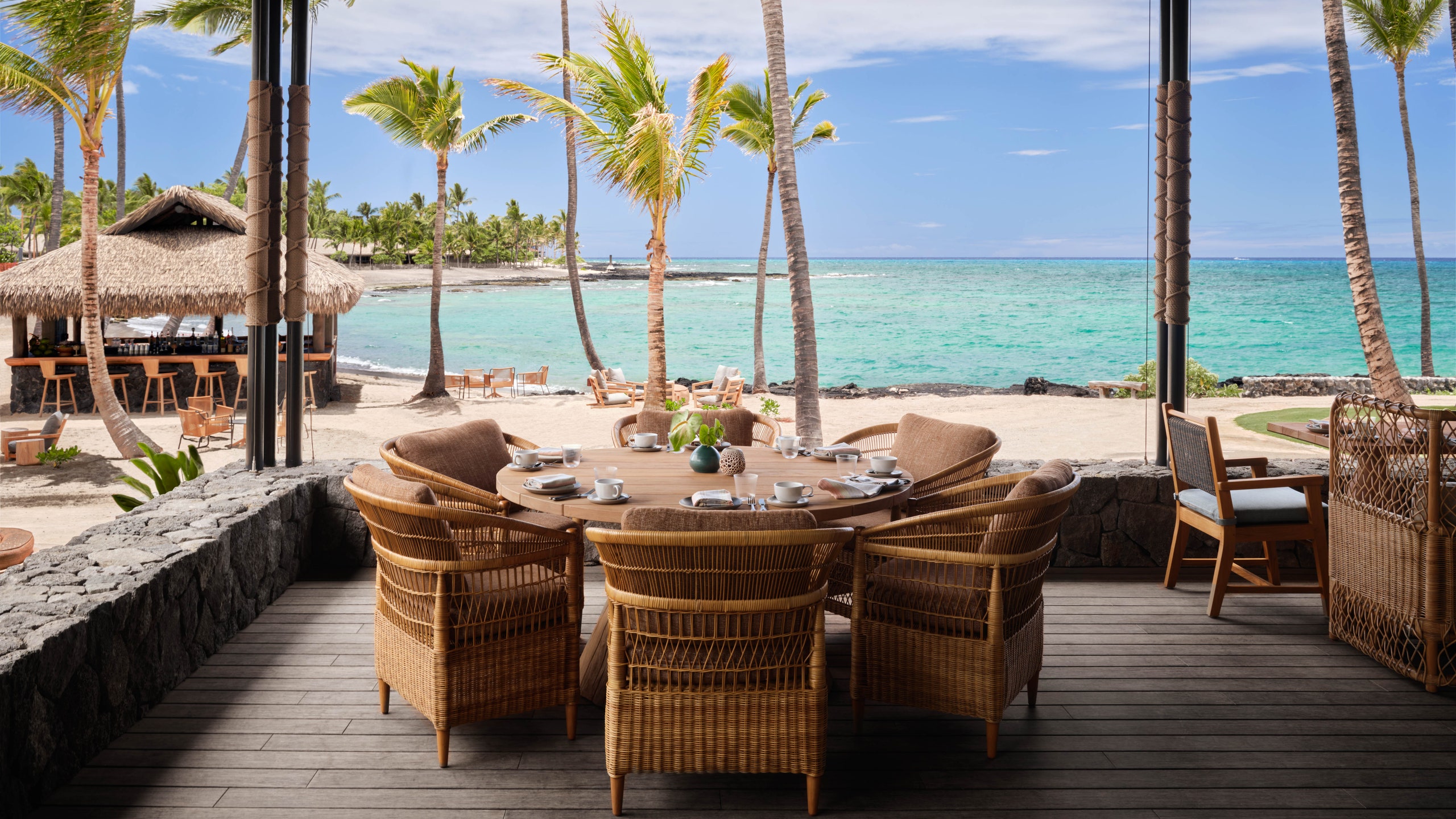 An outdoor restaurant by the beach. 