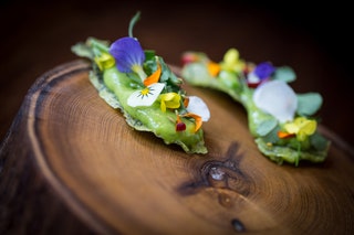 Peaflour wafers with edible flowers at Fera Simon Rogan's Michelinstarred restaurant at Claridge's