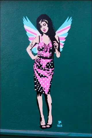 An Amy Winehouse mural by street artist Pegasus