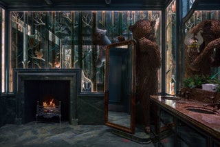 The men's room is inspired by a nighttime woodland scene complete with a lifesize bear.