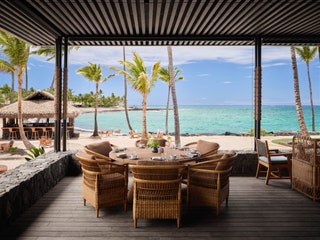 An outdoor restaurant by the beach.