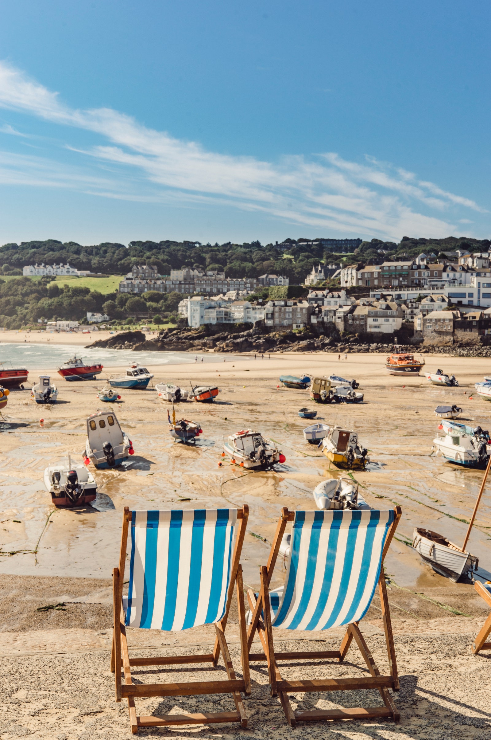 Empty deck chairs along the St Ives beach in the harbour front.