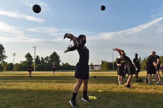 Army Reserve Soldiers attempt the Standing Power Throw, one of six test events for the Army Combat Fitness Test, during Operation Ready Warrior exercise, at Fort McCoy, Wisconsin, August 23, 2020.