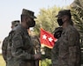 U.S. Army Lt. Gen. Terry Ferrell, U.S. Army Central commander speaks with U.S. Army Reserve Staff Sgt. Bryan Brodt, a technical engineer assigned to the 654th Regional Support Group based in Tacoma, Washington, during a coin ceremony held on Camp Arifjan, Kuwait, November 19, 2020. Ferrell recognized Brodt and Soldiers from ASG-KU who were selected to receive the commander's Coin of Excellence for their exemplary performance of assigned duties in the COVID-19 public health emergency.