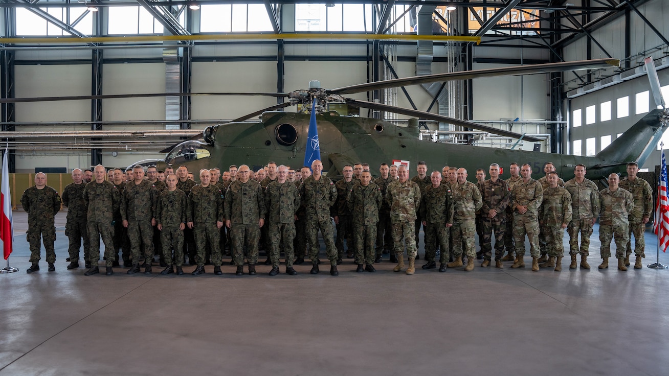 U.S. and Polish Military leaders in attendance pose for a picture at the Polish Apache Initiative summit, Inowrocław, Poland, on August 7, 2024. The initiative taught organizational leaders on AH-64 organizations, combat tactics and maintenance considerations. (U.S. Army photo by Spc. Nolan Brewer)