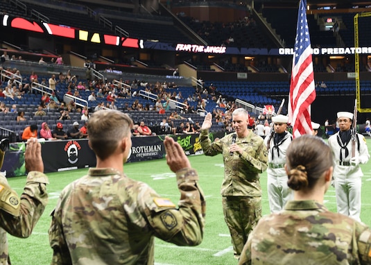 AR-MEDCOM DCG Collard leads affirmation of enlistment ceremony at Arena Football game