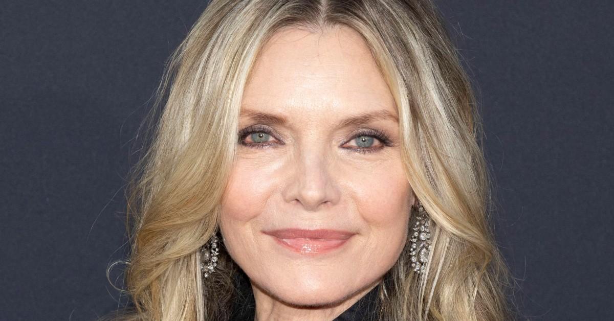 Michelle Pfeiffer posing for a press photo