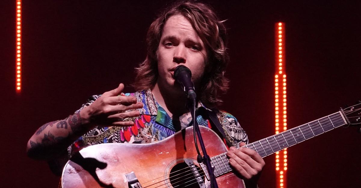 Billy Strings playing at a concert