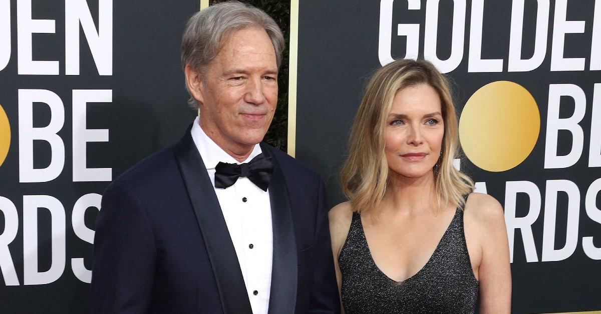 Michelle Pfeiffer and her husband attending an award ceremony