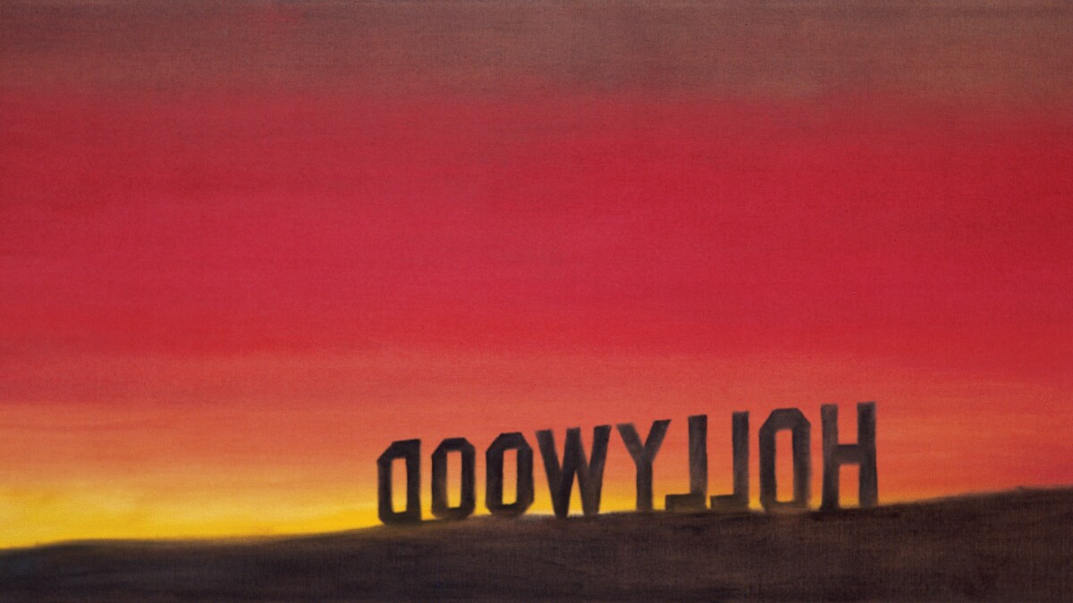 A painting of the back of the Hollywood sign with a deep red and yellow sunset. 