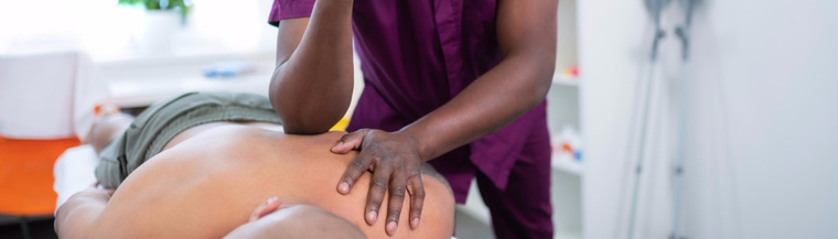 Man receiving a massage from a professional therapist.