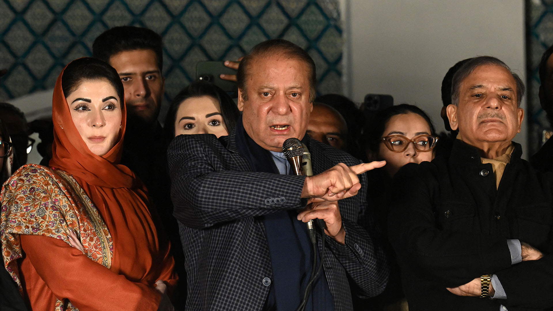 Pakistan's former prime minister stands addresses supporters pointing his finger