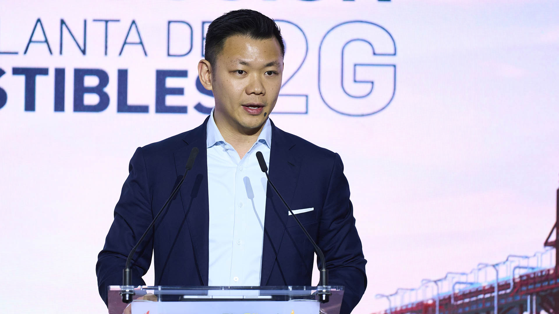 Anderson Tanoto standing at a lectern