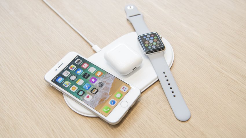 The Apple Inc. iPhone 8, Airpods, and Apple Watch sit on the AirPower charger during an event at the Steve Jobs Theater in Cupertino, California, U.S., on Tuesday, Sept. 12, 2017.