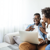 Purchased - Couple reviewing health plans on the sofa