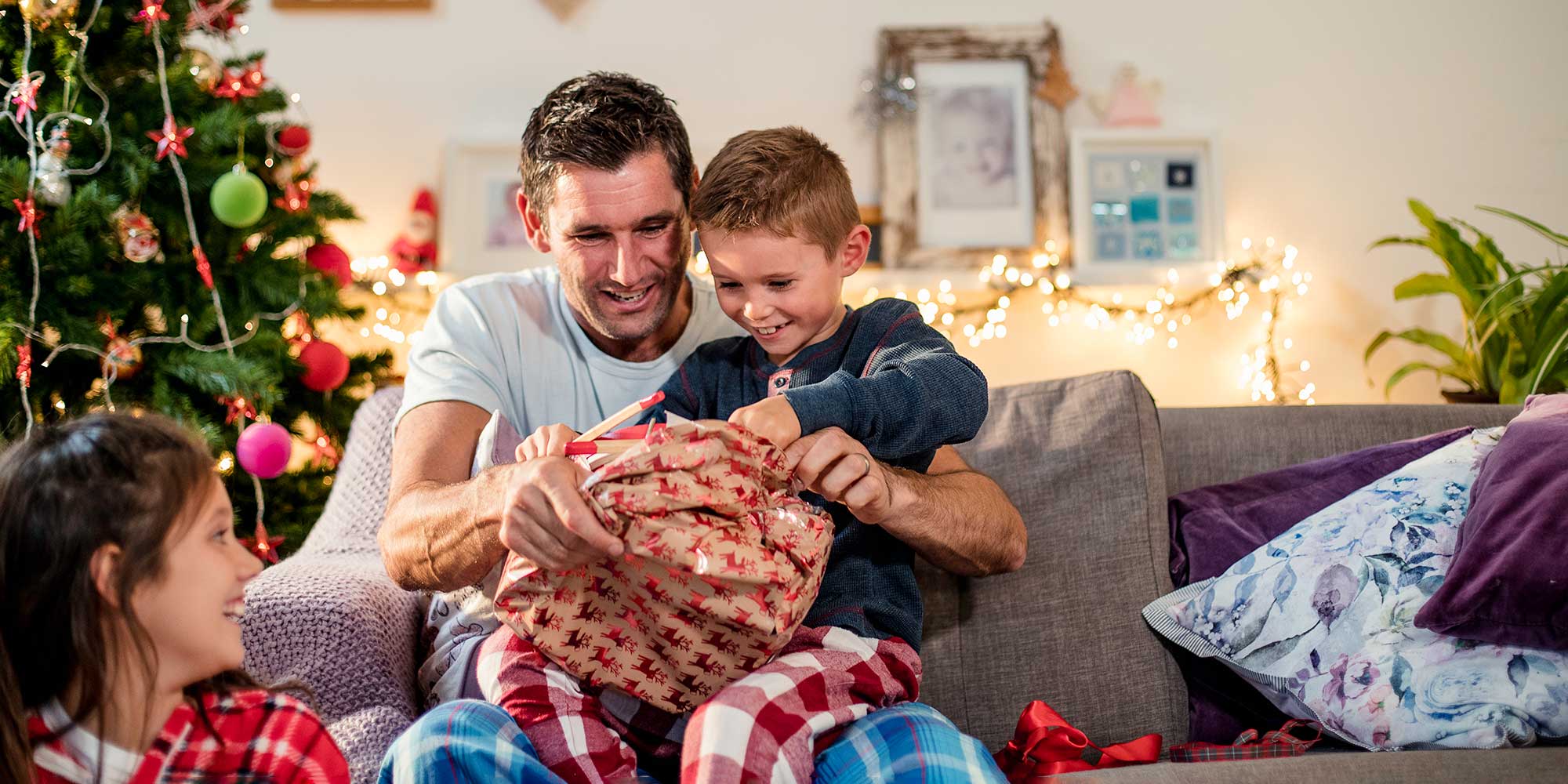 Father and son opening Christmas presents