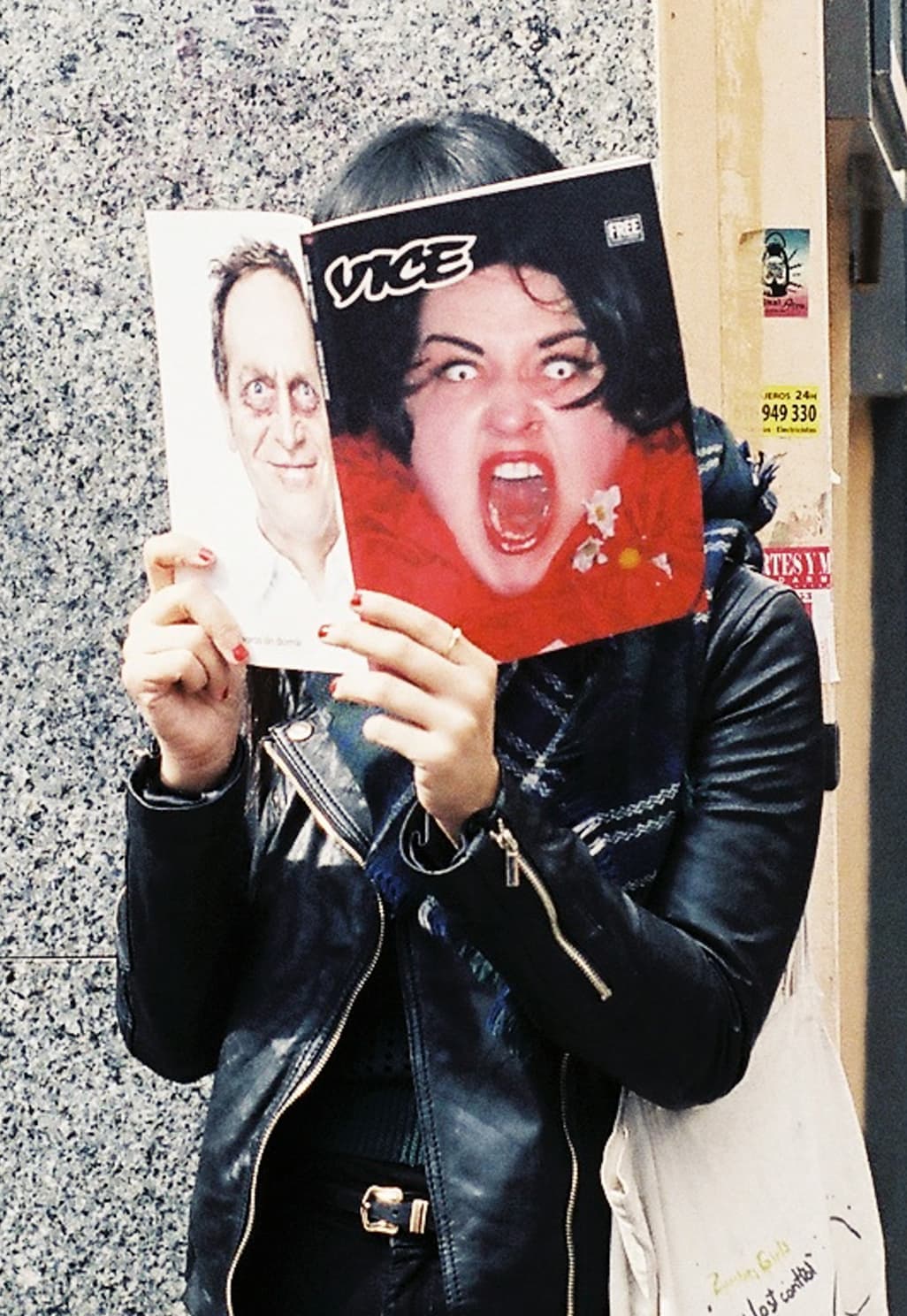 A person reading VICE Magazine.