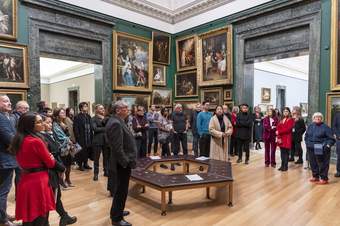 A large group of people in an art gallery