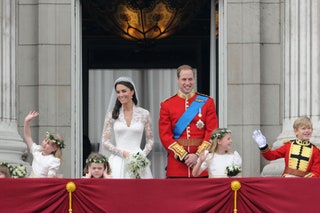 On the balcony of Buckingham Palace with the Duke and Duchess of Cambridge and other flower girls and pageboys on their...