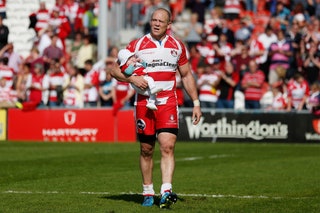 Mike Tindall carries his daughter Mia on the pitch following the Aviva Premiership match between Gloucester and London...