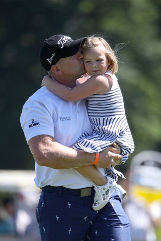 Mike carries daughter Mia at Celtic Manor Resort June 2018