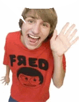 a young man wearing a red shirt that says fred is waving his hand