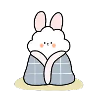 a cartoon rabbit is wrapped in a blanket .