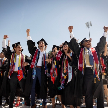 Class of 2024 students cheering during commencement. 