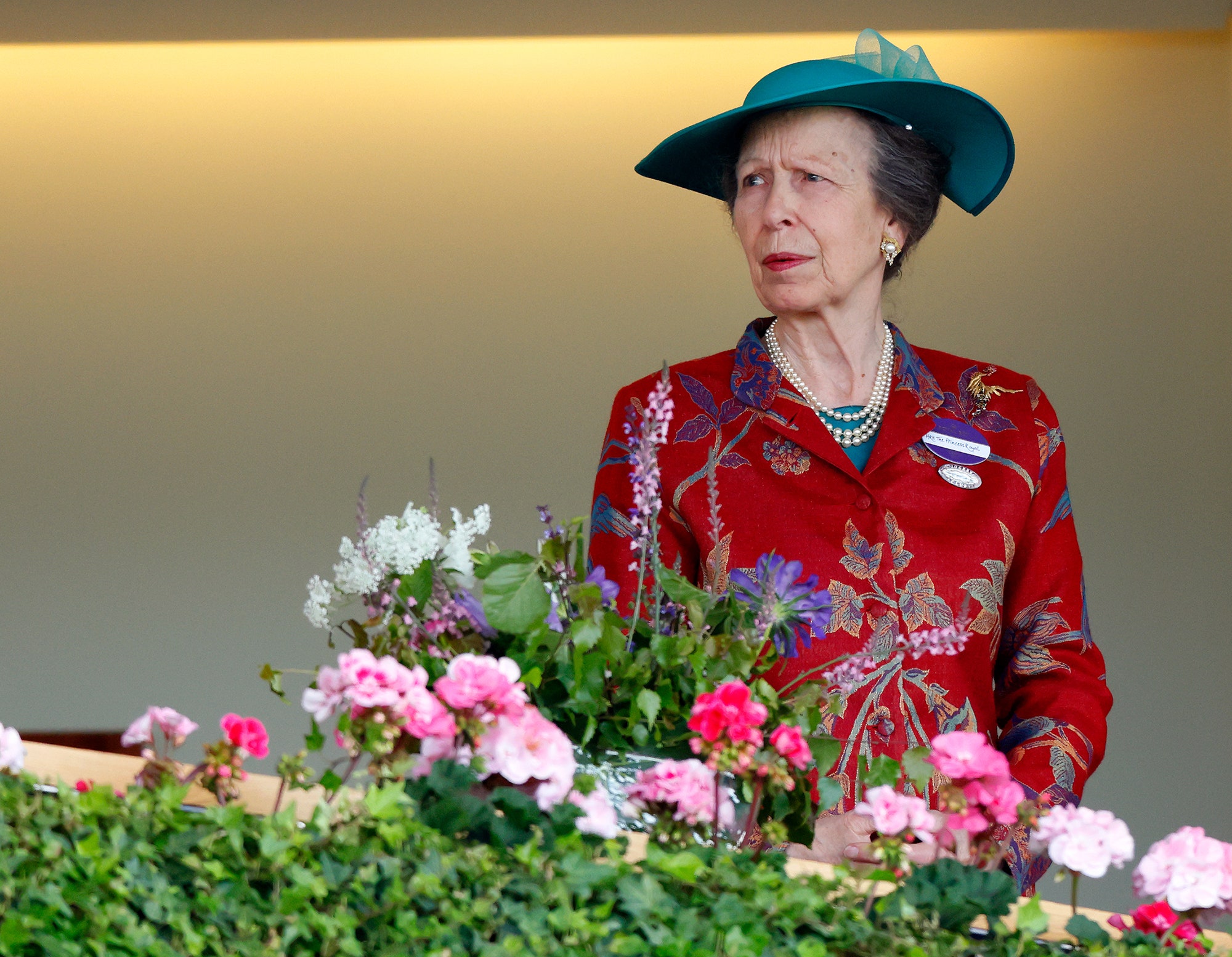 Image may contain Anne Princess Royal Person Plant Potted Plant Flower Geranium Adult Clothing and Hat