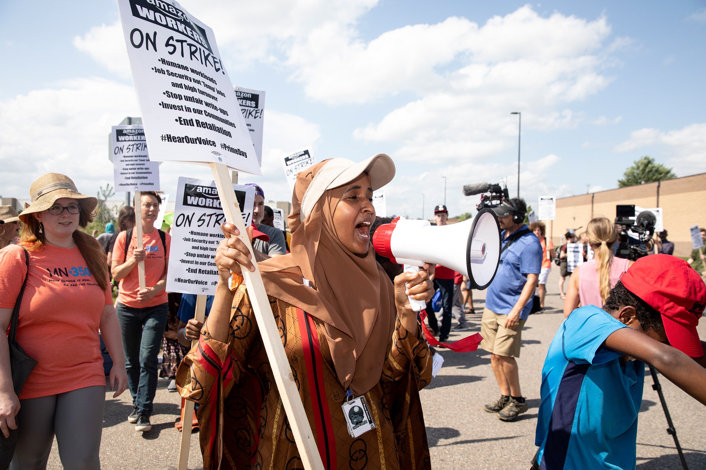 Amazon workers holding protest signs