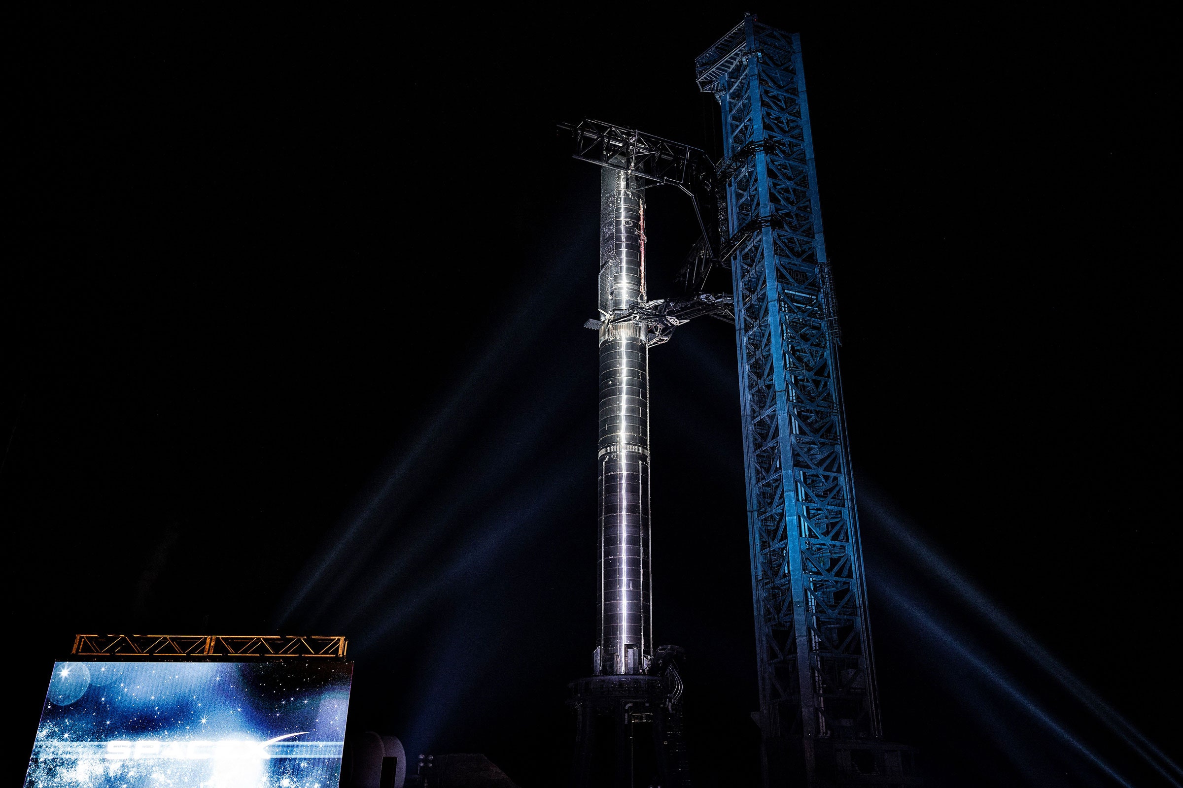 Starship SN20 atop Super Heavy Booster 4 at night in South Texas