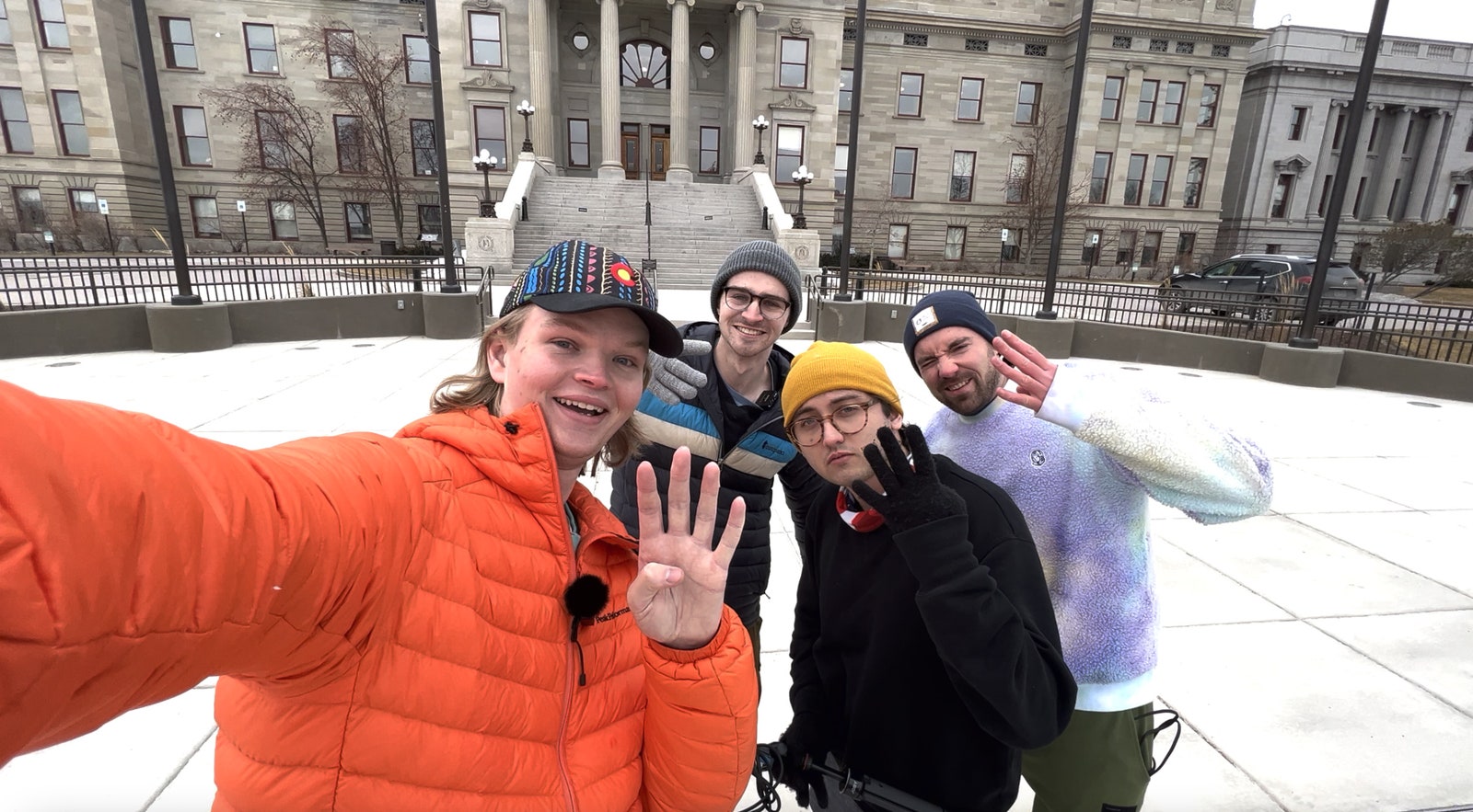 Multiple people posing for selfie