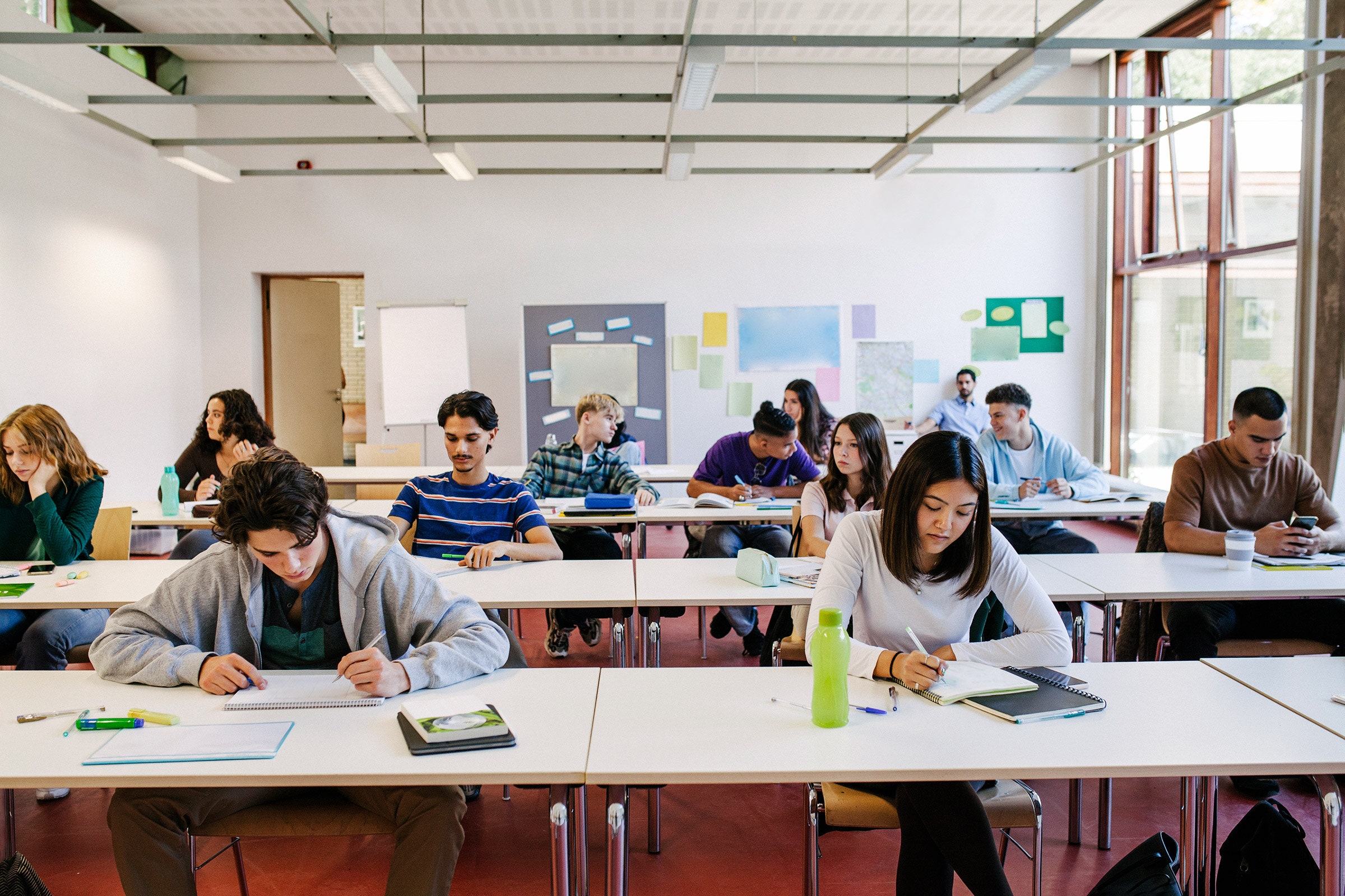 A group of high school students working at their desks during a class