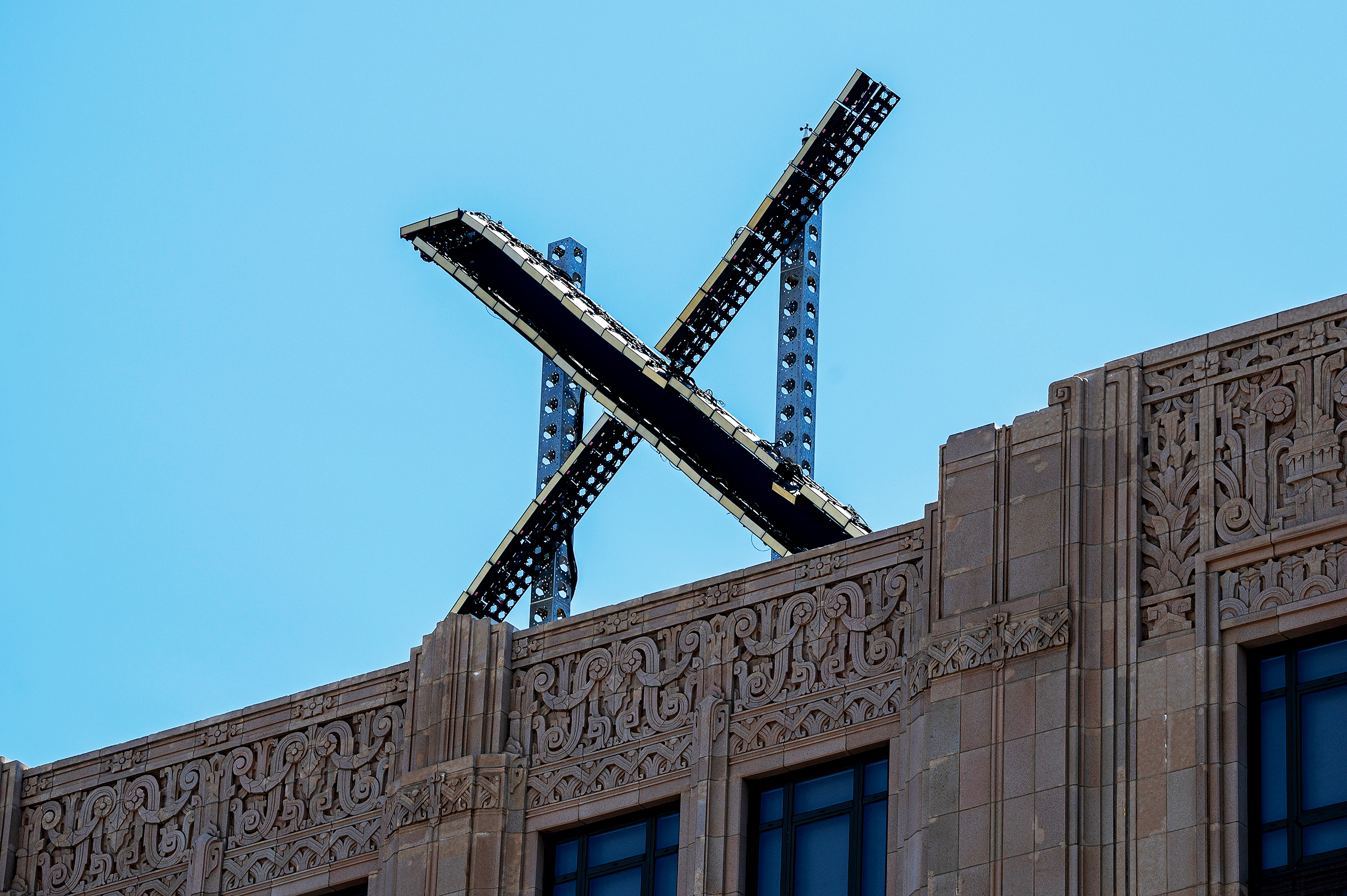 X logo on top of a building