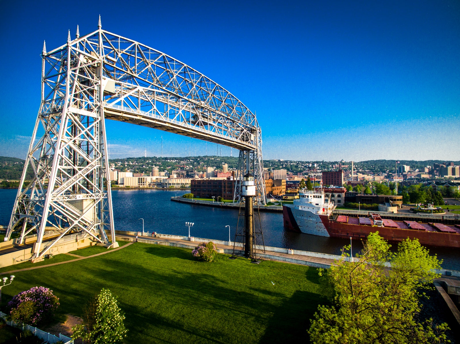 Image may contain Arch Architecture Arch Bridge Bridge Boat Transportation Vehicle Water Waterfront and Nature