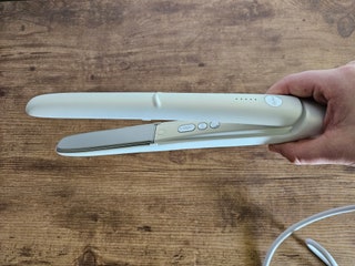 Person holding Drybar Reserve 3 hair straightener