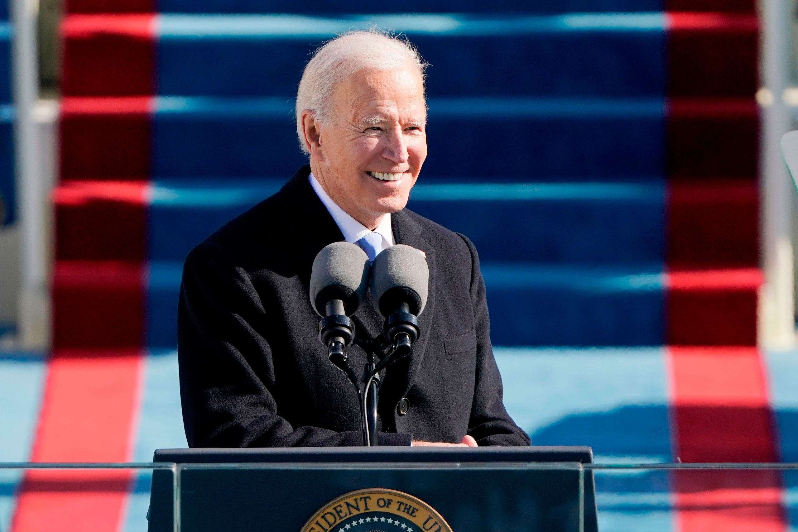 Image may contain Joe Biden Crowd Person People Electrical Device Microphone Adult and Audience