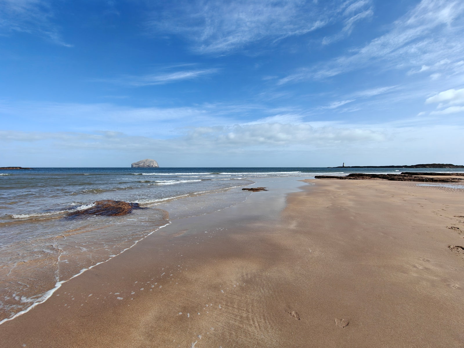 Sandy beach on blue sky day