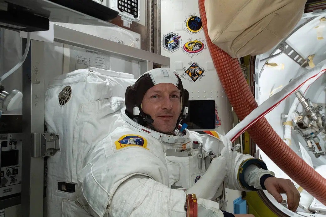 ESA astronaut Matthias Maurer conducts a fit check of his U.S. spacesuit inside the International Space Station's Quest...