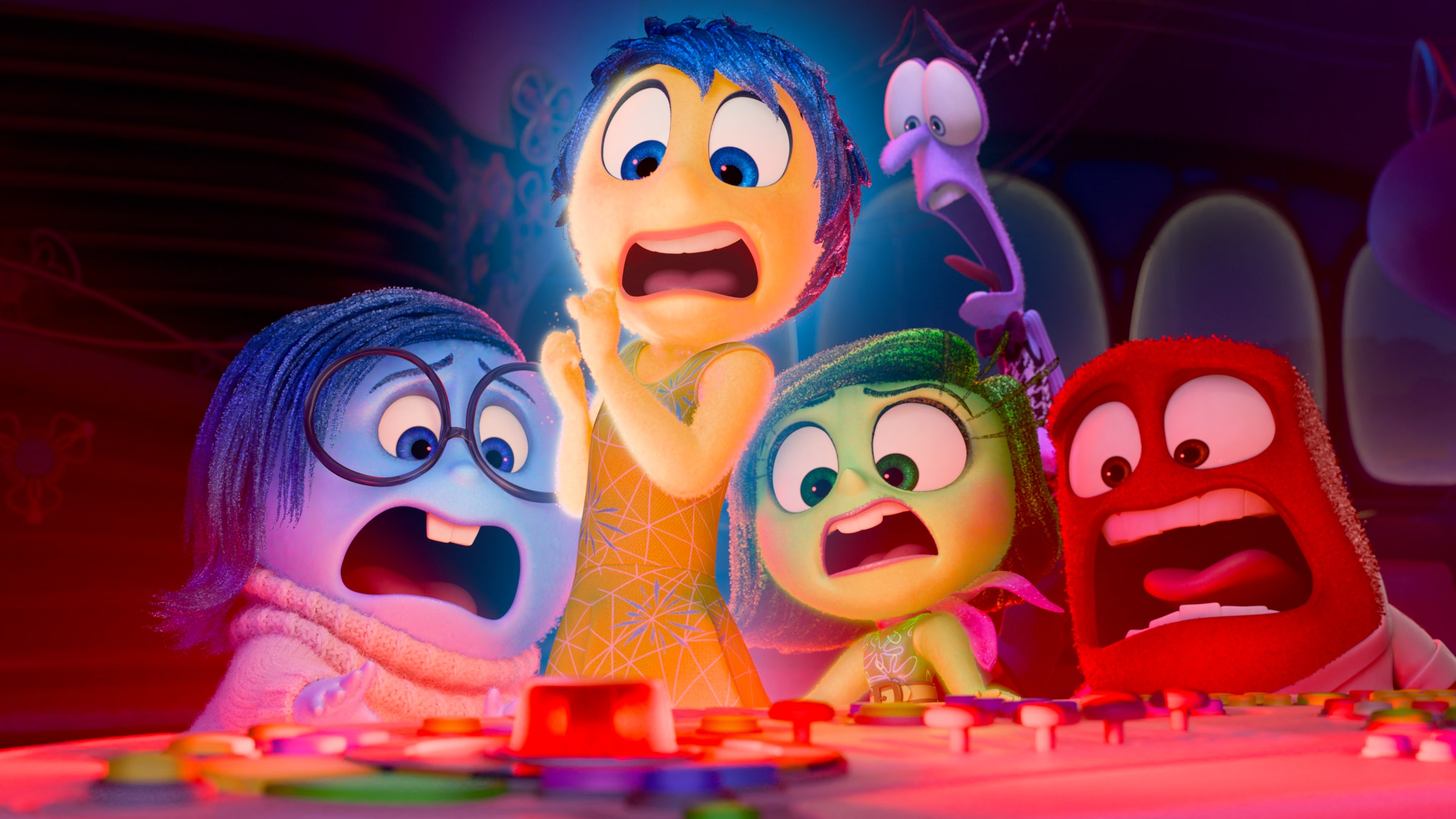 A still from the DisneyPixar film Inside Out 2 with some of the Emotions reacting fearfully to an alarm.