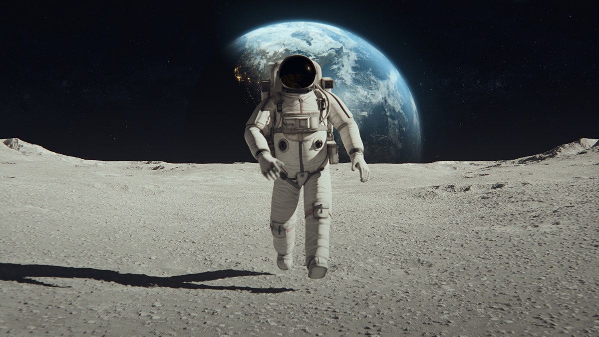Photo of Astronaut in Space Suit Confidently Walking on the Moon Surface.