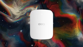 White square device with rounded edges and silver letters spelling 'eero' on the front. Background black silver and red...